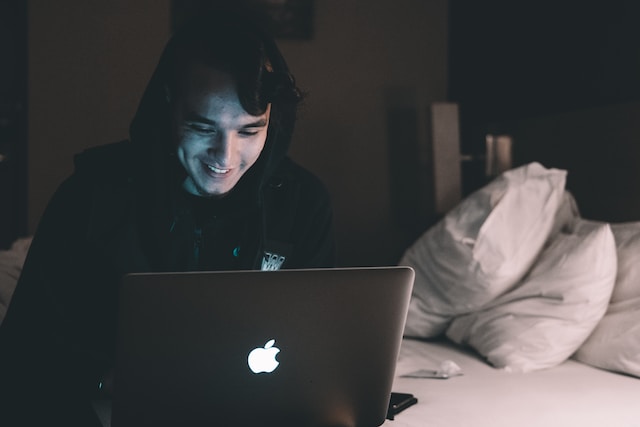 Man playing online slot at home